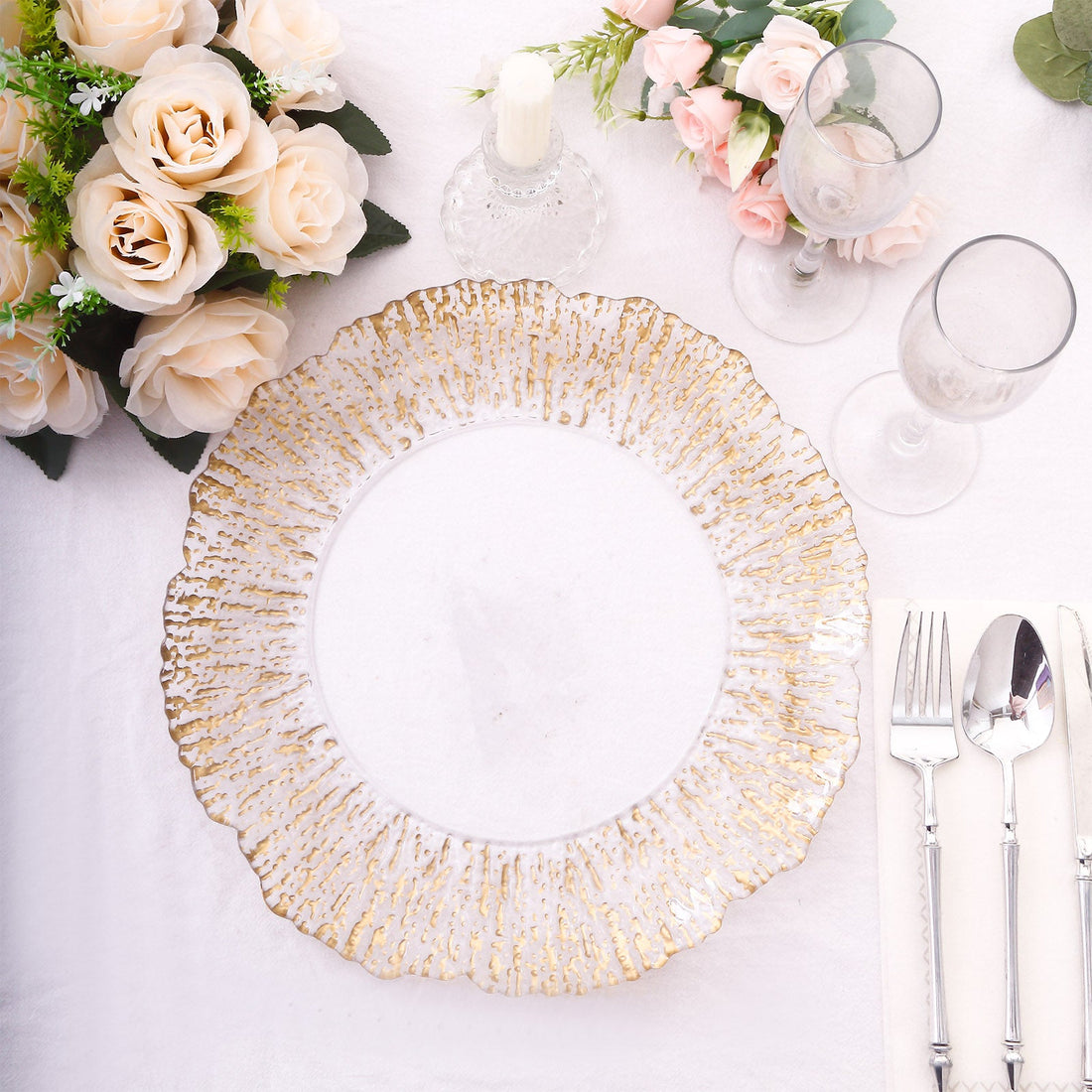 Elegant gold-rimmed plate on a beautifully set dining table.