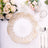 Elegant gold-rimmed plate on a beautifully set dining table.