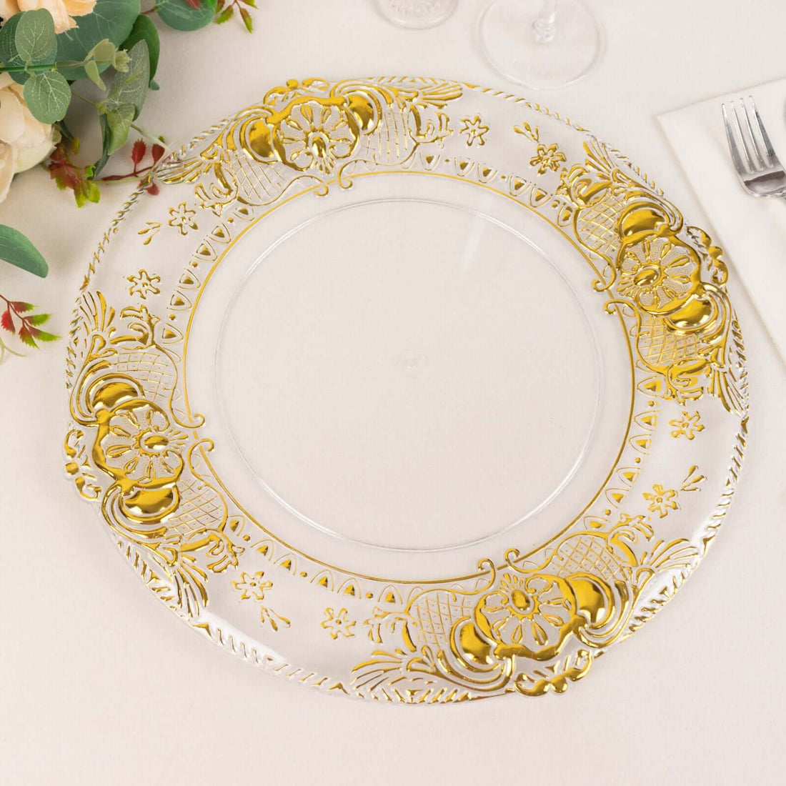 Elegant gold-accented clear charger plate for dining decor.