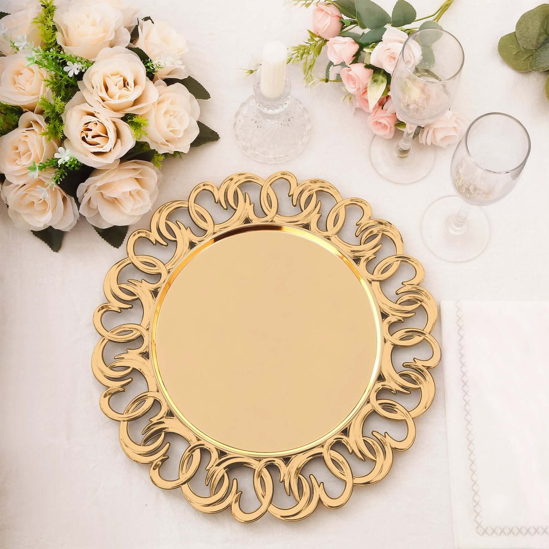 Elegant gold decorative serving platter on a table with floral accents.