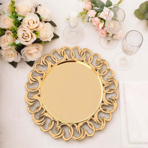 Elegant gold decorative serving platter on a table with floral accents.