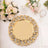 Elegant gold decorative serving platter on a table with floral accents.