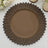 Brown sunflower-shaped decorative plate on a white background