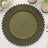 Green decorative plate with leaf-shaped rim on white background