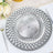 Elegant silver decorative charger plate with intricate geometric design.