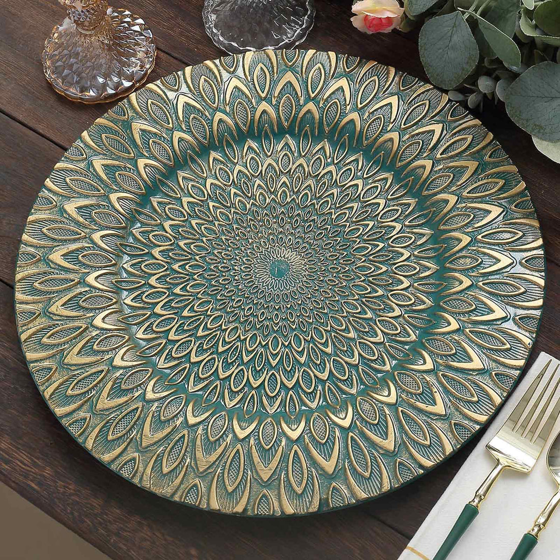 Decorative teal and gold patterned serving platter on a wooden table.