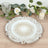Decorative white plate with intricate floral design on a wooden table
