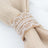 Linen napkin with lace trim on a white background
