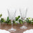 Elegant crystal wine glasses with intricate patterns on a wooden surface.