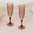 Elegant pink champagne flutes in a stylish design.