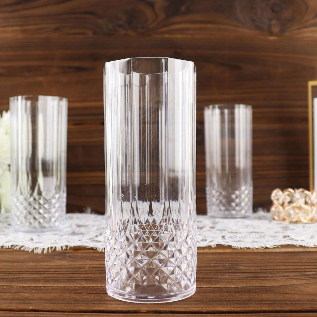 Clear crystal glass with diamond patterns on a wooden table.