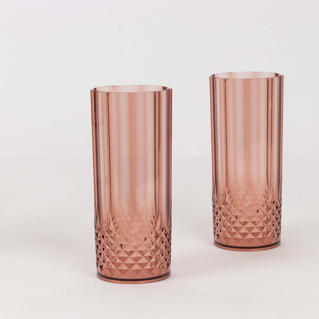 Set of two elegant rose-colored glass tumblers