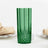 Green diamond-patterned drinking glass on a plain background.