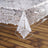 Clear lace tablecloth overlay on a wooden table. #whtbkgd
