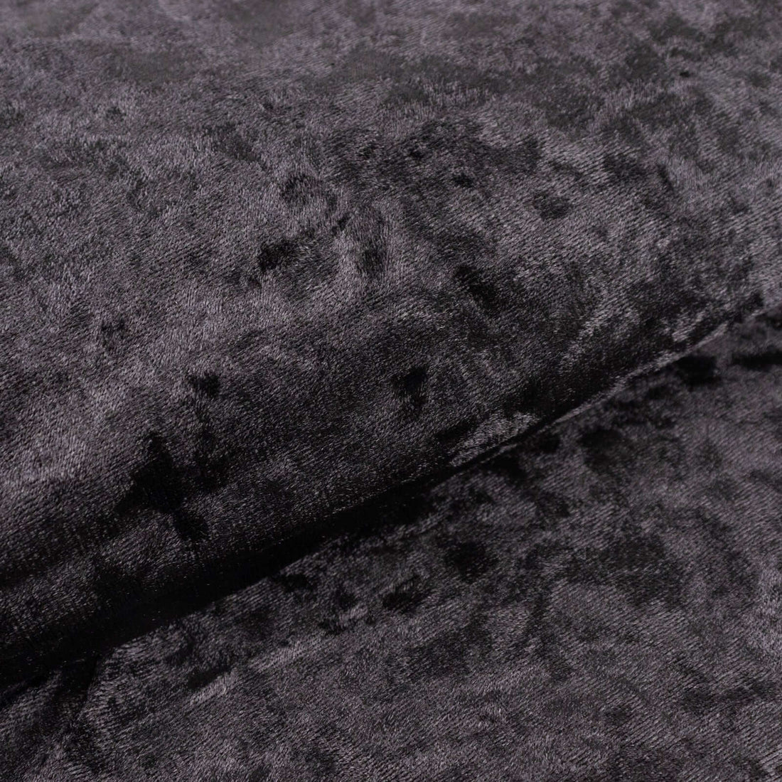 Black textured fabric with a soft, plush surface.