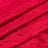 Luxurious red velvet fabric texture in folds.