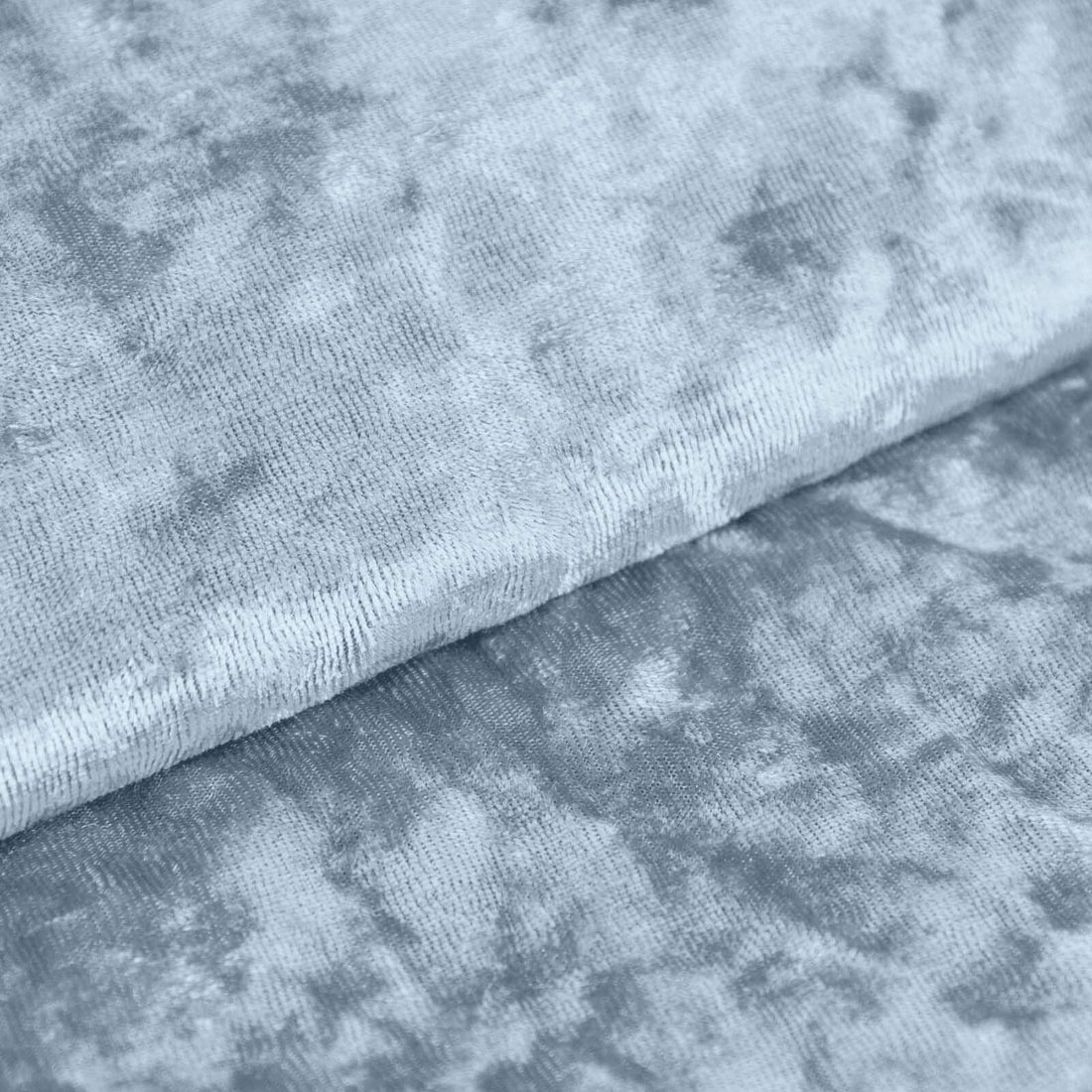 Soft blue textured fabric close-up showcasing its luxurious quality and detail.
