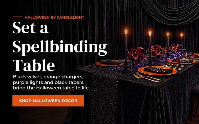 Transform your Halloween table with black velvet, orange chargers, purple lights, and black taper...