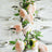 Table setting with pink flowers and glassware for an elegant dining experience.
