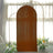 Brown fabric backdrop with curved frames and floral accents.