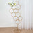 Gold hexagon flower stand with floral arrangement