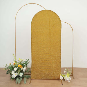 Gold sequined backdrop with metal frame and floral arrangements.
