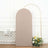 Beige fabric backdrop with curved top and gold arch, adorned with flowers