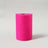 Bright pink roll of craft paper on a plain backdrop