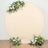 Floral backdrop with yellow and white flowers on a round canvas.