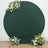 Green circular backdrop with floral arrangements for photography.