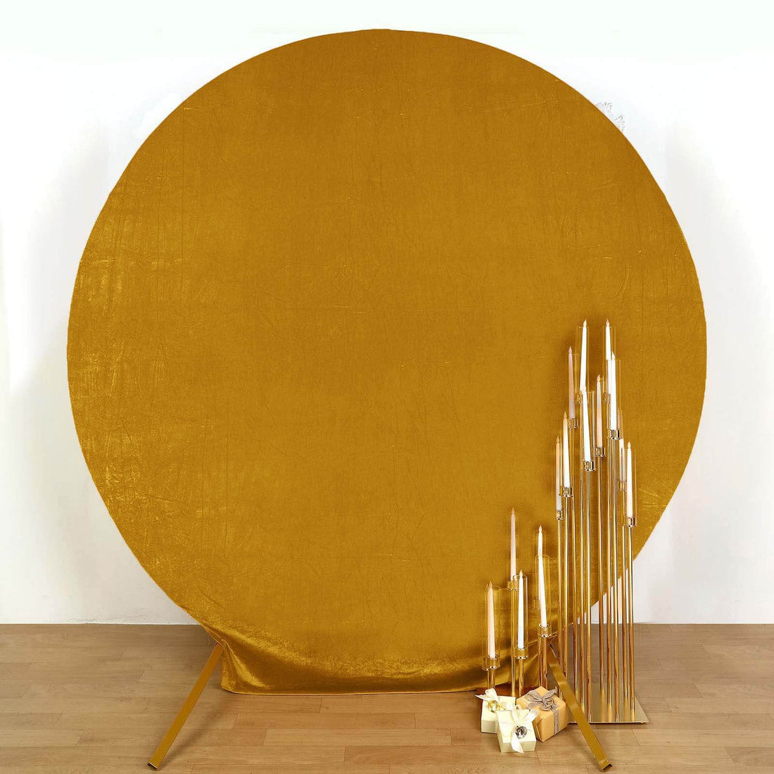 Gold circular backdrop with elegant candlestick display.