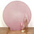 Pink glitter backdrop with decorative gold candle holders and candles.