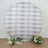 Round backdrop with floral arrangements for photography.