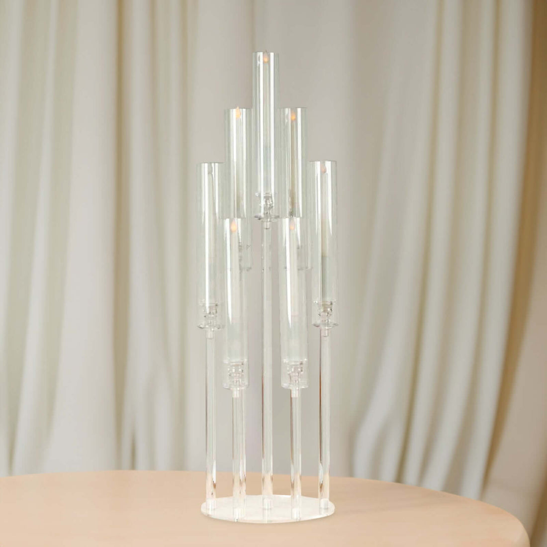 Modern glass candle holder with multiple transparent tubes for elegant decor.