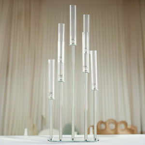 Clear glass candle holder with multiple tubes in a modern design.
