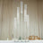 Clear glass candle holder with multiple tubes in a modern design.