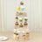 Tiered cupcake stand displaying various decorated cupcakes and desserts.
