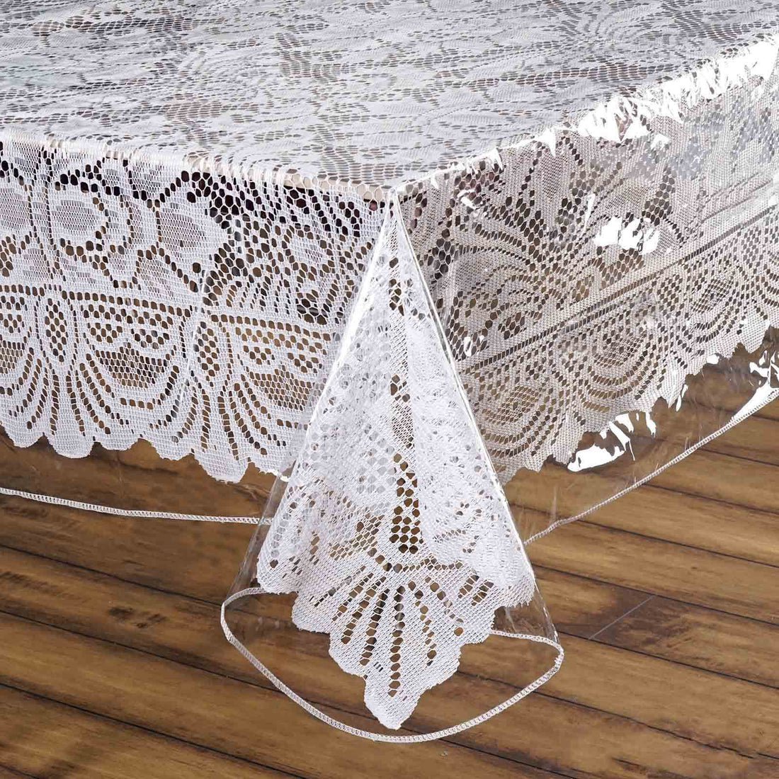 Clear lace tablecloth with intricate floral design. #whtbkgd
