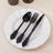 Elegant black cutlery set on a white plate