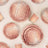 Rose gold party plates and cups with glitter design, arranged on a neutral background.
