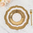 Gold decorative plate with intricate design on a marble surface.