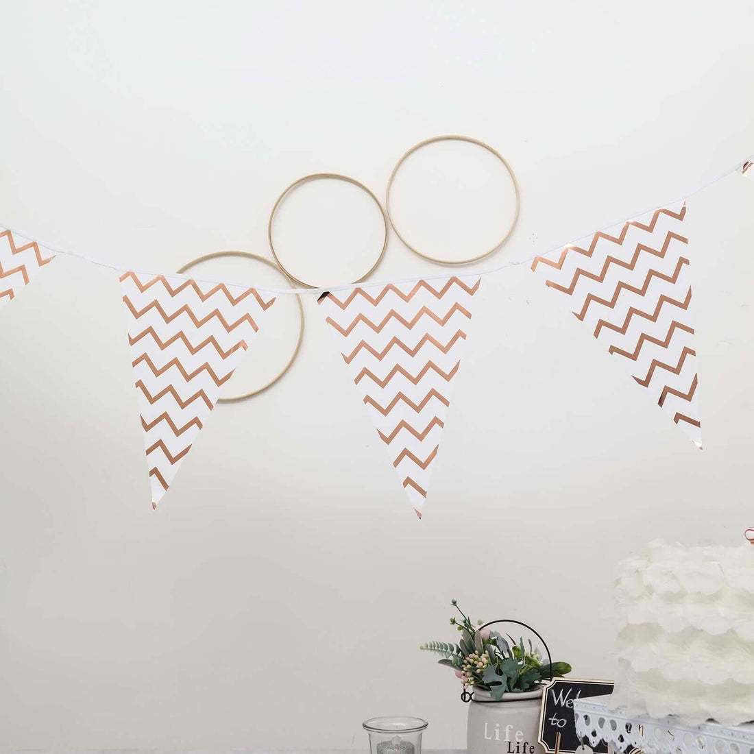 Rose gold chevron patterned bunting banner for party decorations.