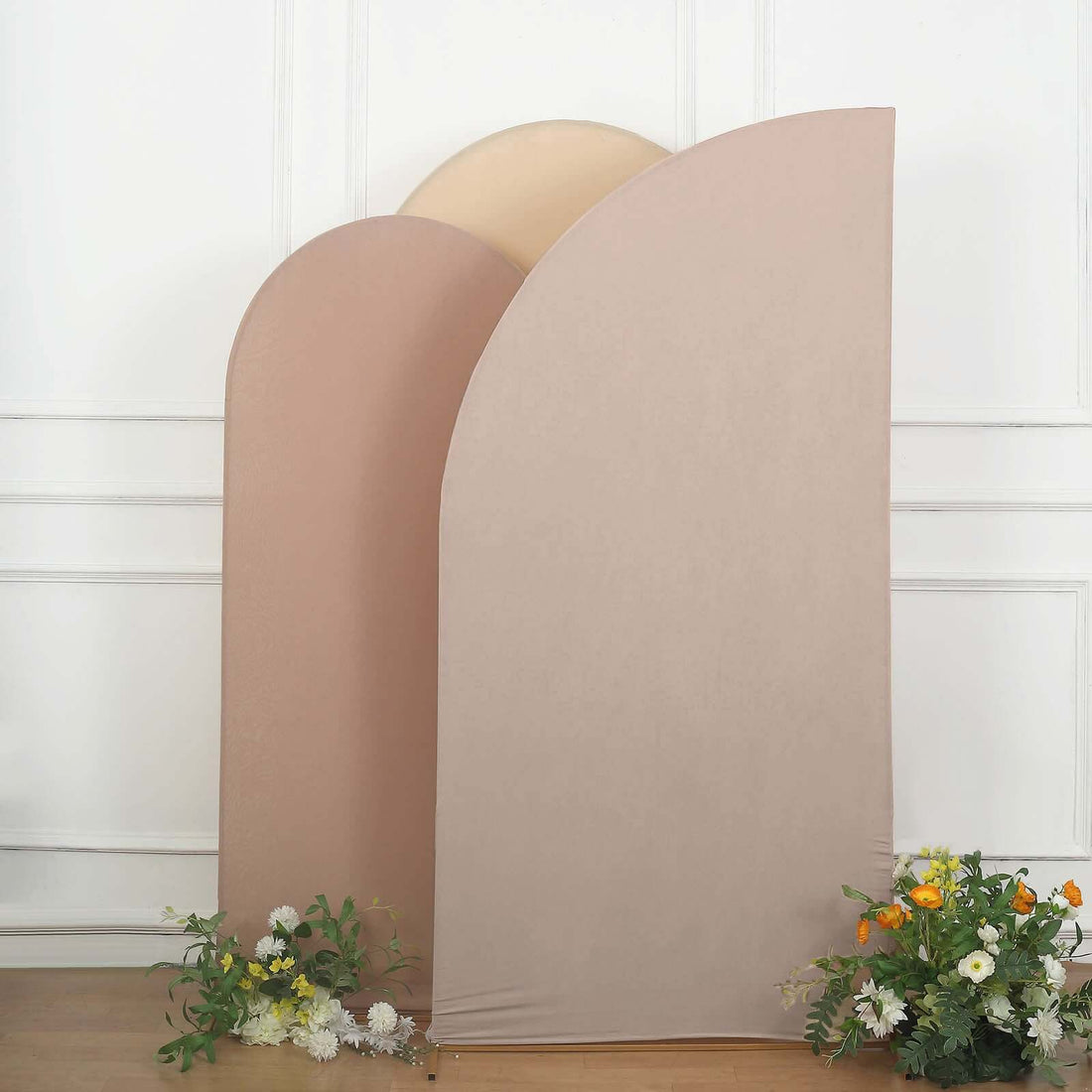 Three curved fabric panels in soft colors with flowers in front