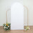 White backdrop with gold frame and floral arrangements