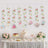 Tea party decorations with floral motifs and a dessert table setup.