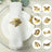 Gold leaf napkin rings displayed on a dining table setting.