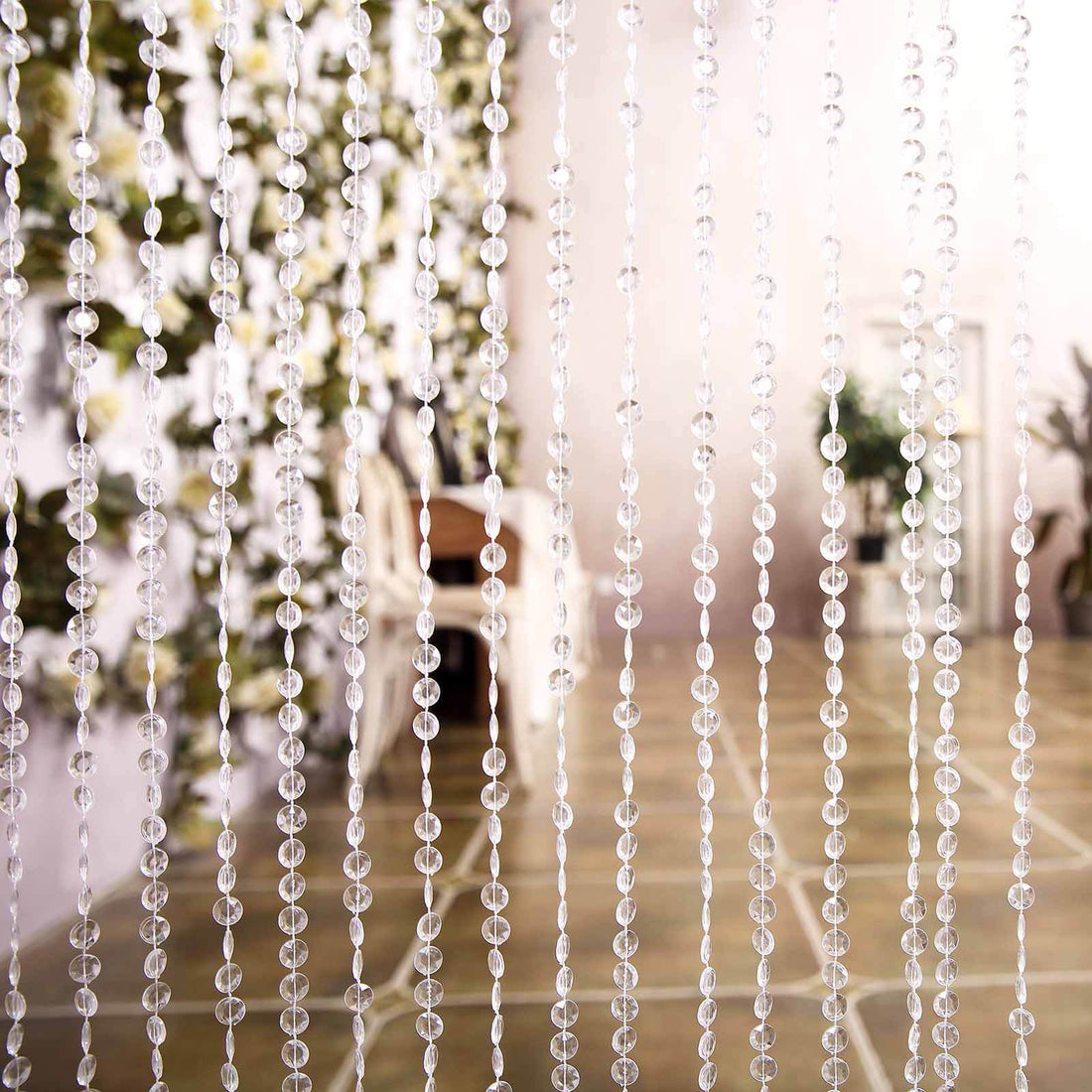 Clear bead curtain hanging in a modern interior setting.