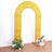 Yellow arch with floral arrangements, perfect for events and photo backdrops.