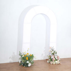 White arch with floral arrangements at the base