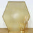 Gold hexagon backdrop with elegant candle holders